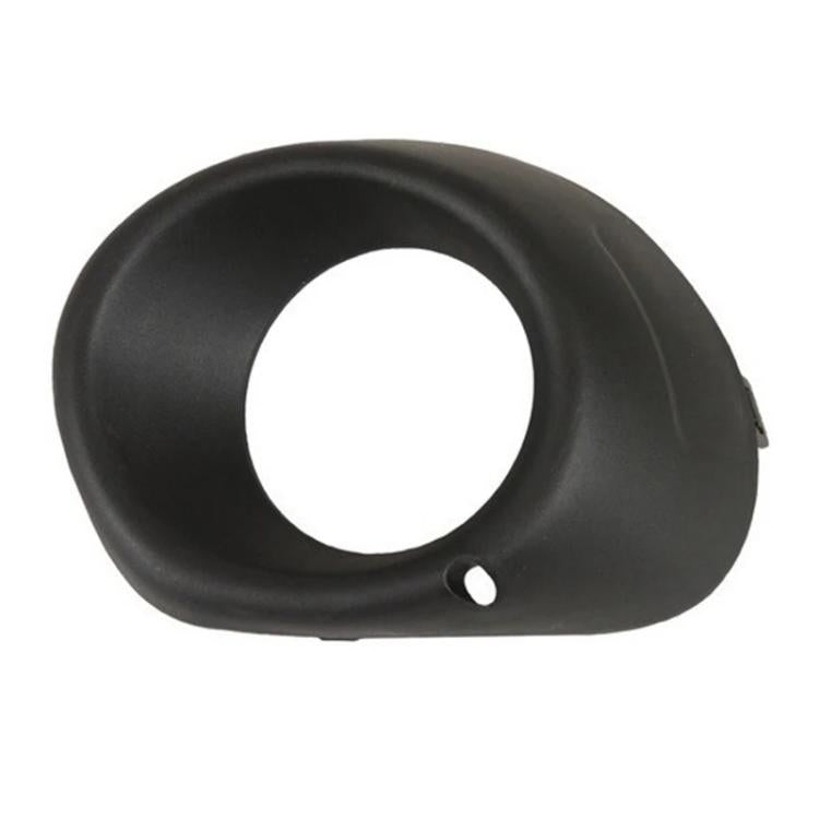 Black fog light bezel cover with round opening and lower mounting hole