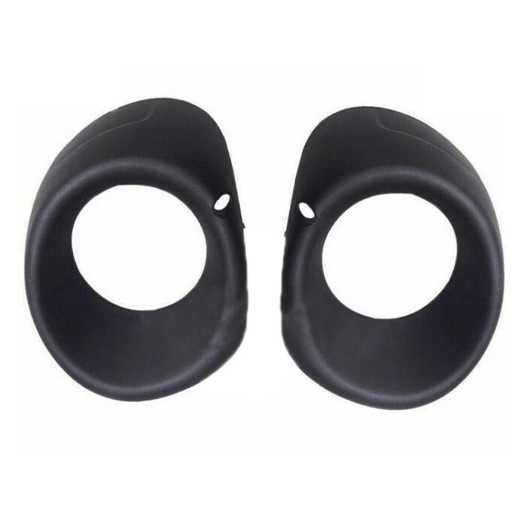 Set of two black fog light bezels with circular openings and side mounting holes