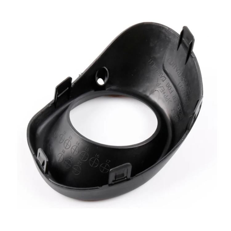 Black fog light bezel housing with circular opening, clip tabs, and mounting recess