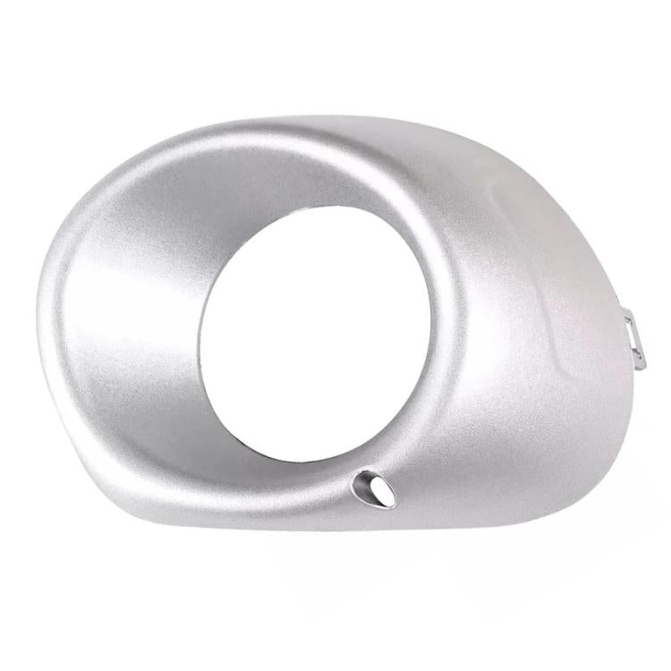 Silver fog light bezel cover with round opening and lower alignment hole
