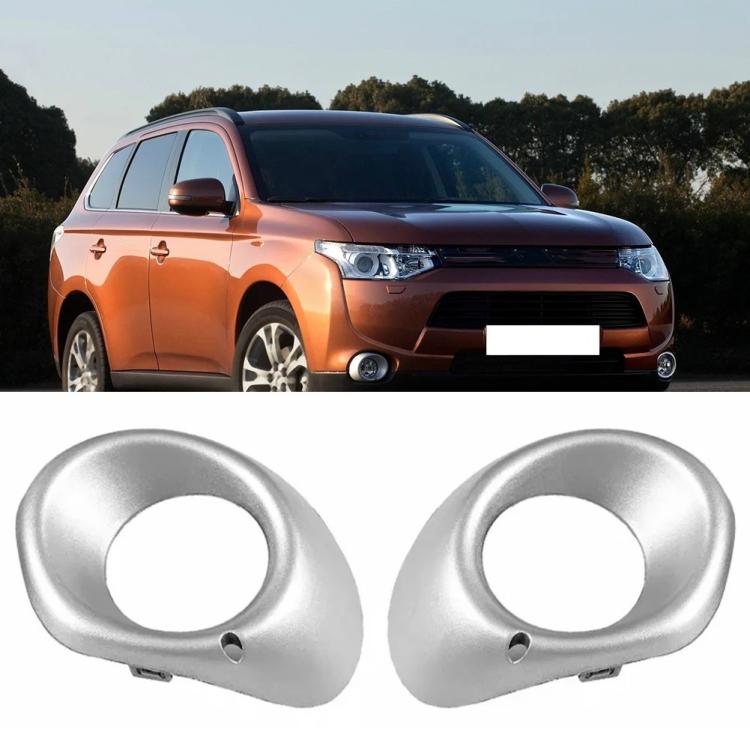 Pair of silver fog light bezels with circular openings and mounting holes