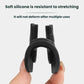 Single black silicone door limiter cover held in hand; oval body with square opening.