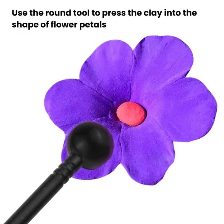 Round-tip pottery sculpting pen shaping flower petals in purple clay