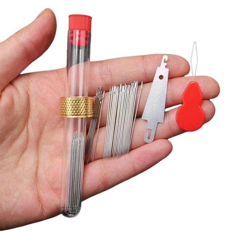 Large-hole sewing needle set with clear red-capped tube, silver needles, and red threader tools
