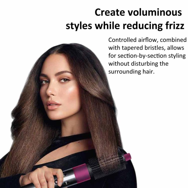 Volumizing brush attachment with rose pink top held near hair during styling