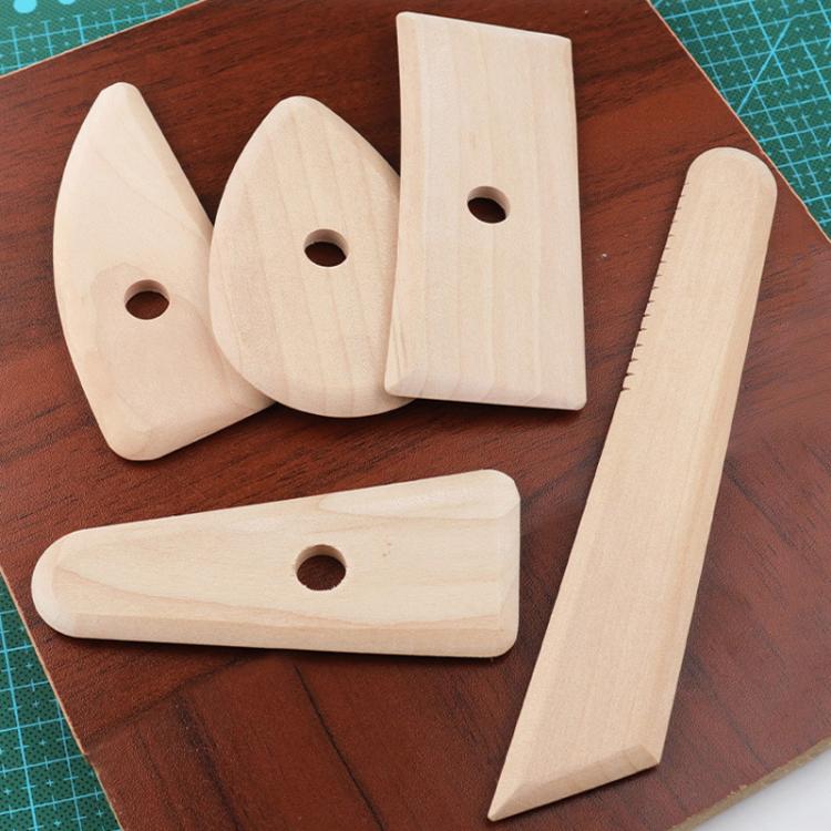 Set of five light wood carving tools with round finger holes