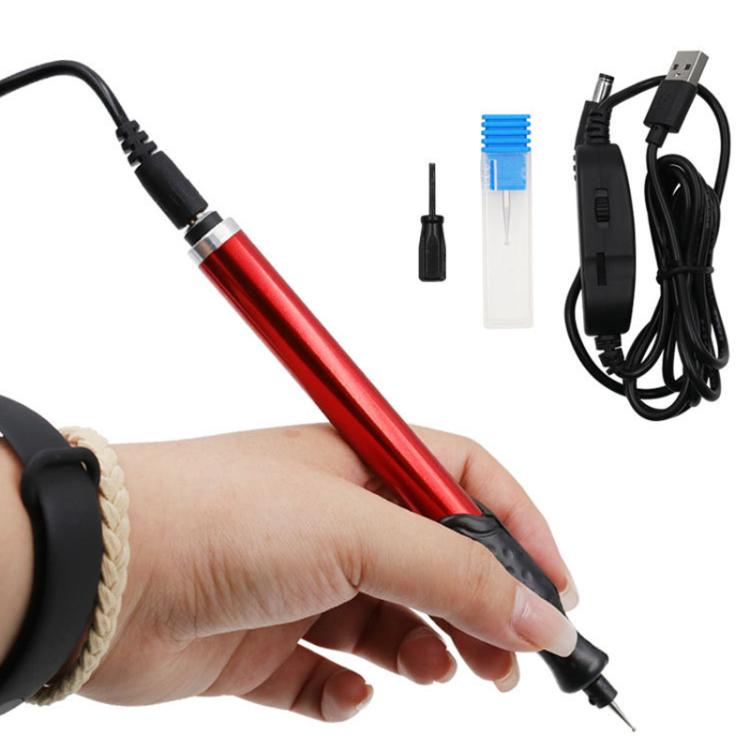 Red electric engraving pen with black grip, pointed bit, and USB power cable