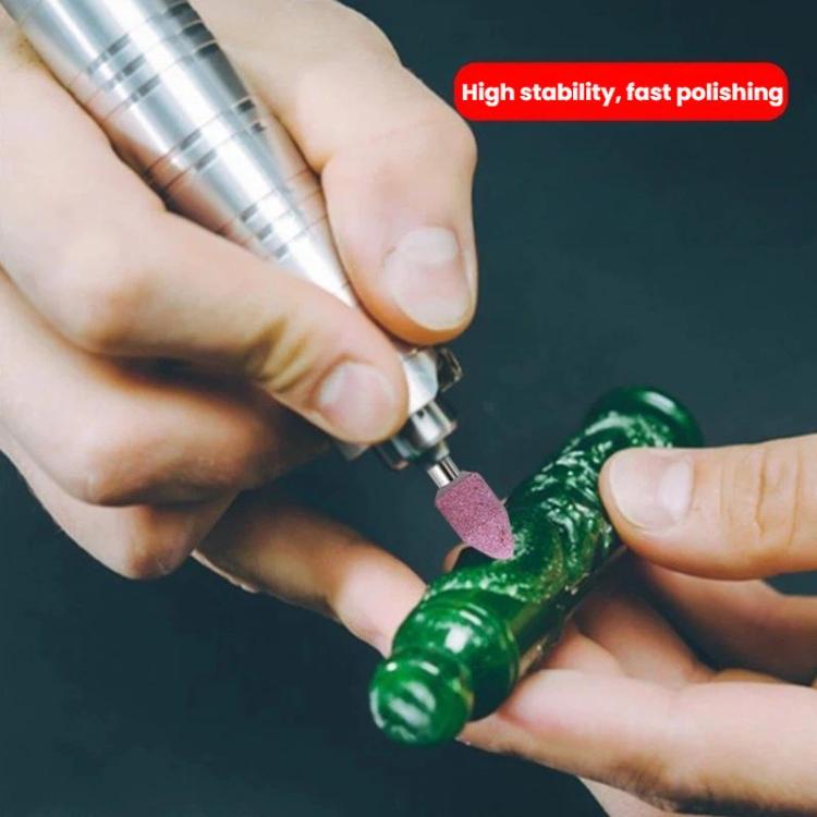Mounted sanding and polishing grinding head held on a rotary tool, pink abrasive
