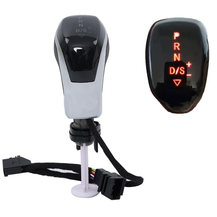 Illuminated LED gear shifter knob with red-lit gear symbols, chrome finish and white body