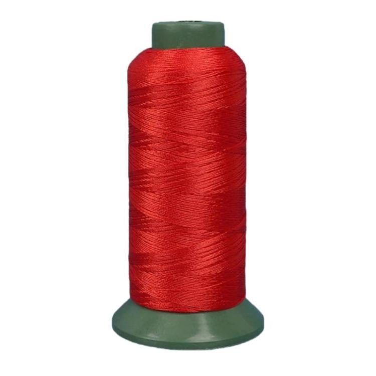 Nylon sewing thread spool, red 3-strand thread on green base.