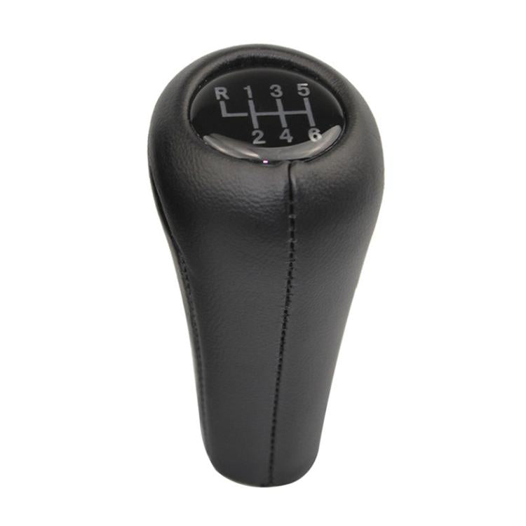 Black leather gear shift knob with numbered shift plate and stitched center seam