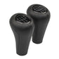 Set of two black leather gear shift knobs with numbered shift plates