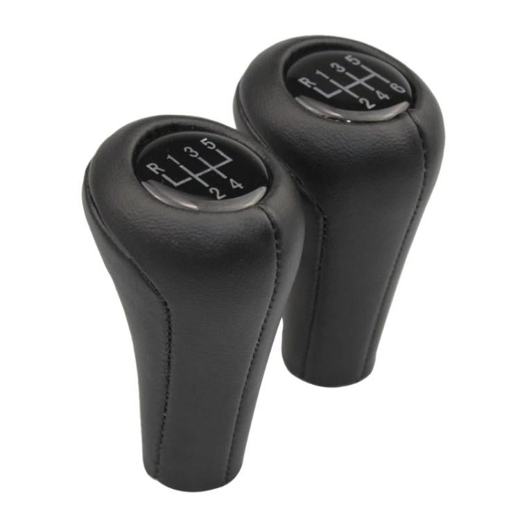 Set of two black leather gear shift knobs with numbered shift plates