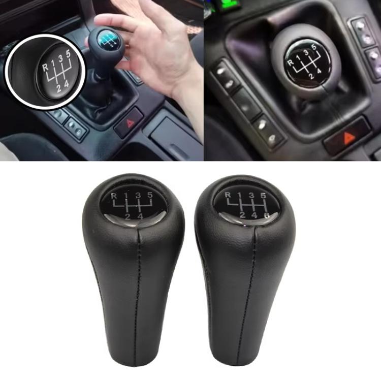 Black leather gear shift knob installed on car center console, with numbered shift plate