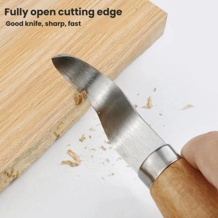 Beech-handled carving knife with pointed curved blade cutting wood