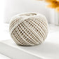 Cotton rope packaging thread spool in beige and white braided yarn