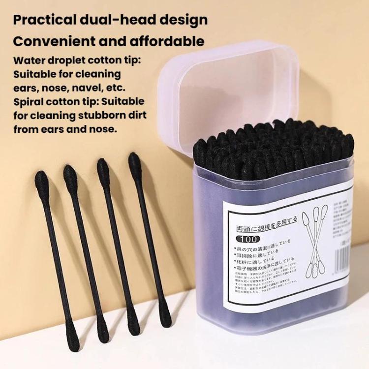 Assorted disposable dual-head cotton swabs, black tips with several swabs laid out