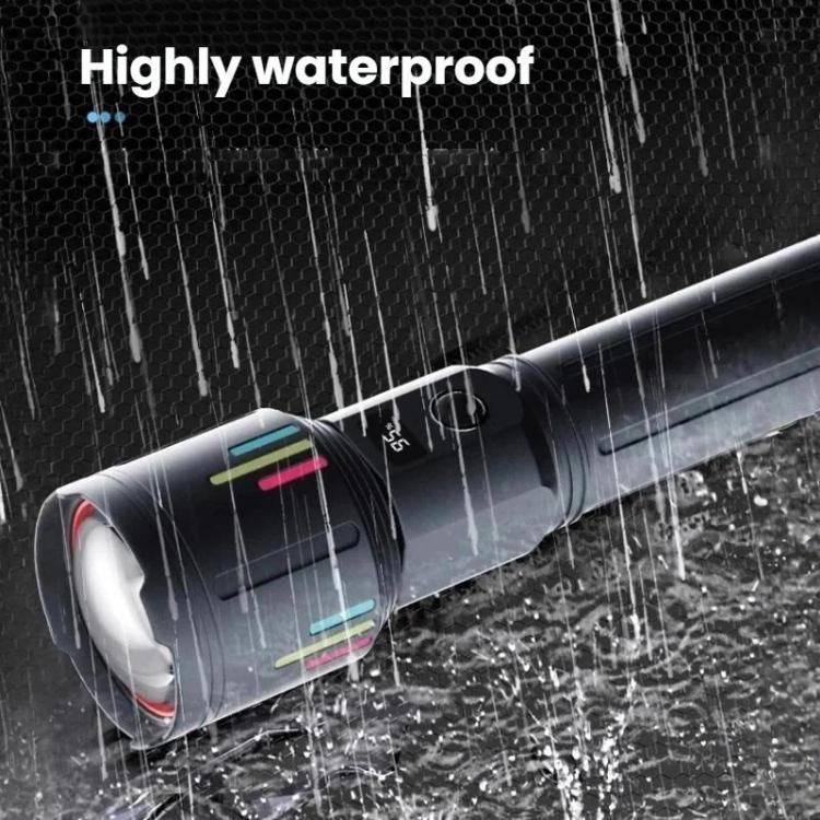 Handheld black flashlight with textured grip and wide beam head