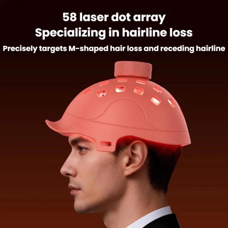 Red laser hair growth cap worn on a man's head with LED dot openings
