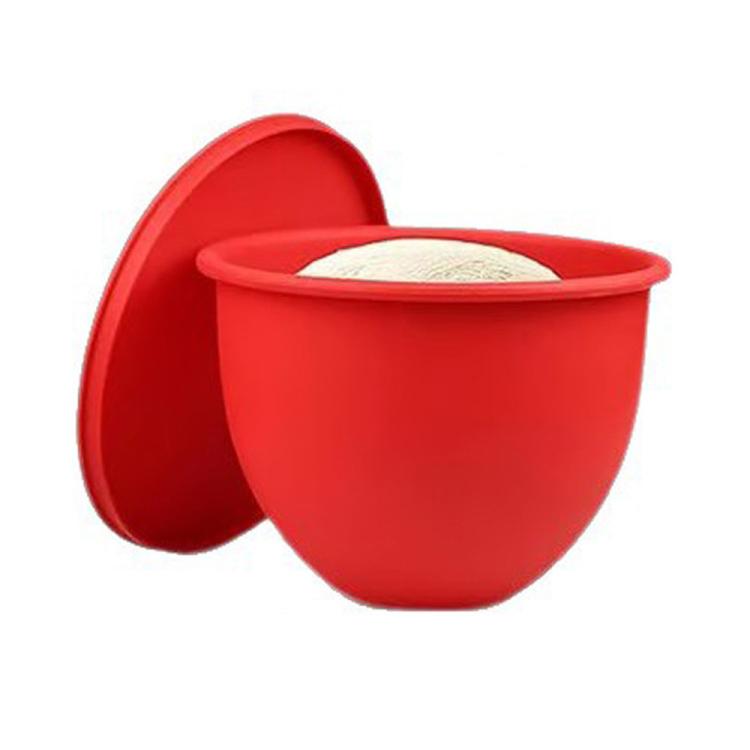 Red silicone mixing bowl lid with insert, open to show liner