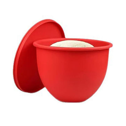 Red silicone mixing bowl lid with insert, open to show liner