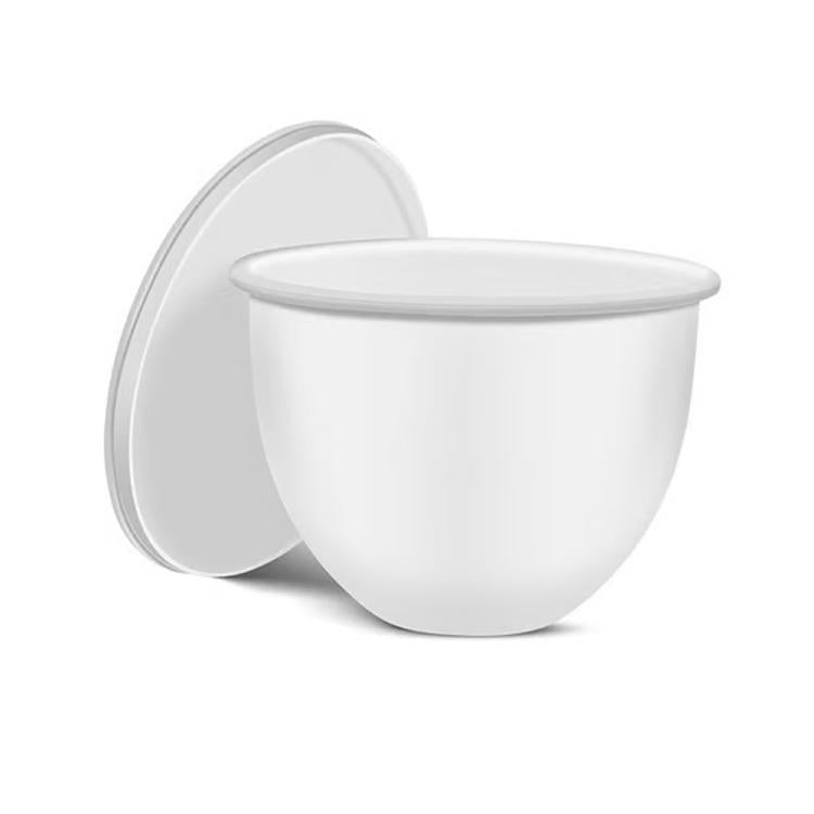 White silicone mixing bowl lid with insert, open to show liner