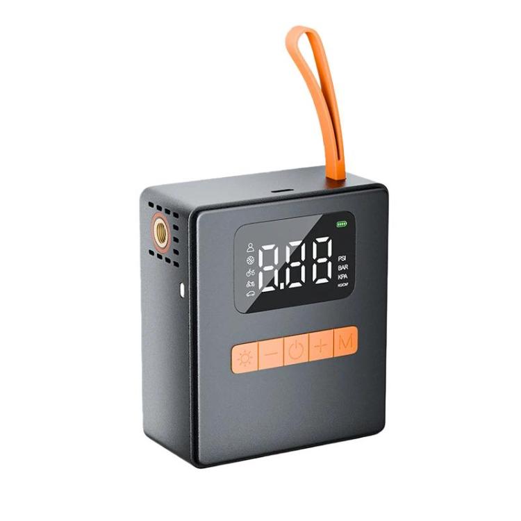 Portable digital tire inflator with LCD screen and orange carry handle, dark grey body