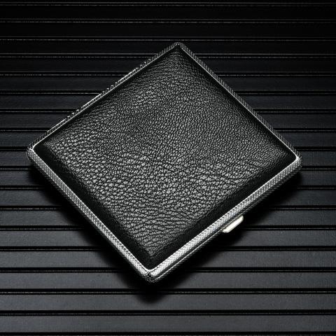 Black textured leather cigarette case with metal edges, hinged lid closed.