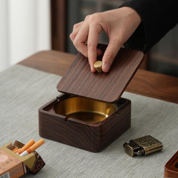 Walnut wood square magnetic ashtray with lid lifted, brass insert visible inside