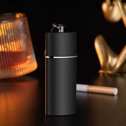 Portable metal-lined pocket ashtray, black cylindrical with key-ring handle
