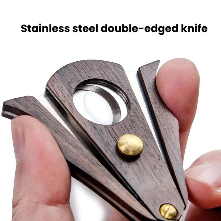 Handheld cigar cutter with dark wood body and stainless double-edged blade