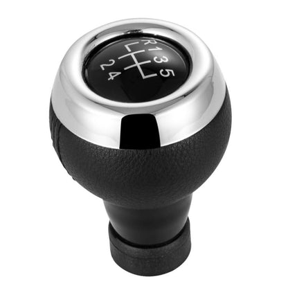 Black leather 5-speed manual shift knob with chrome top and gear numbers 1–5 & R