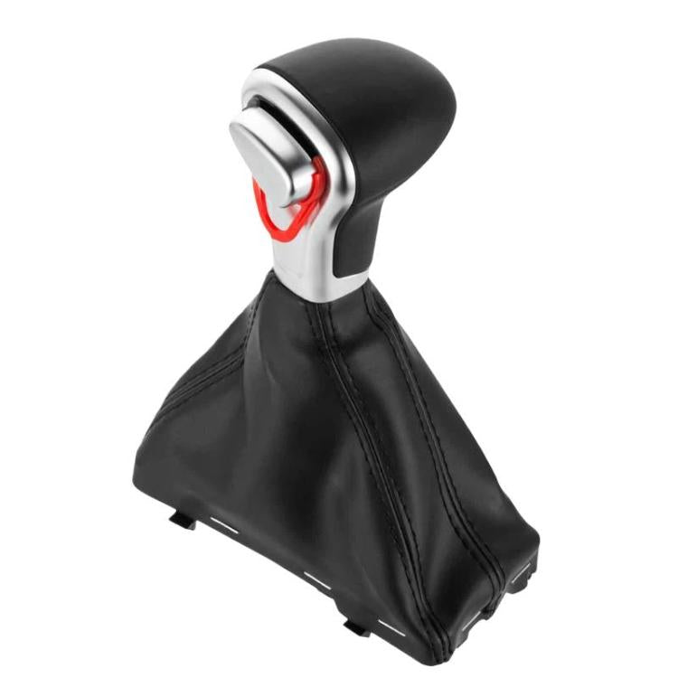 Automatic gear shifter knob with black leather boot, silver trim, red release symbol.