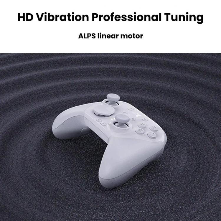 White mechanical game controller lying on its back with dual analog sticks