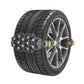 Black and metal tire traction chain on a silver-spoke wheel, side view
