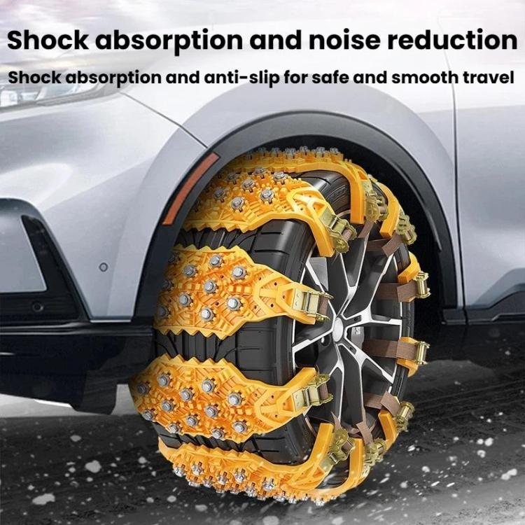 Yellow tire traction chains wrapped on vehicle wheel with multiple studbed links