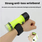 Waterproof diving flashlight worn with anti-loss wrist strap on bright green body