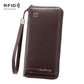 Dark brown RFID zip clutch wallet with wrist strap and textured leather finish