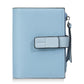 Blue compact snap wallet with white front tab and side zipper coin pocket pull