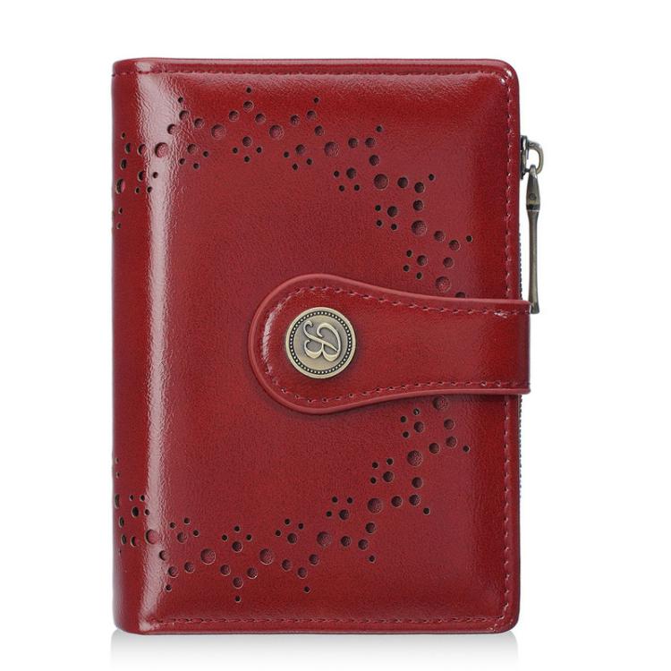 Women’s short wallet in red oil-waxed leather with perforated pattern and zipper