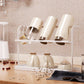 White double-tier cup rack holding upright cups and small bottles