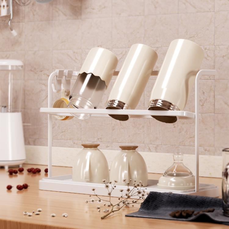 White double-tier cup rack holding upright cups and small bottles