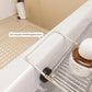 Silver stainless steel bathtub caddy with anti-slip stabilizer clamp and side railing