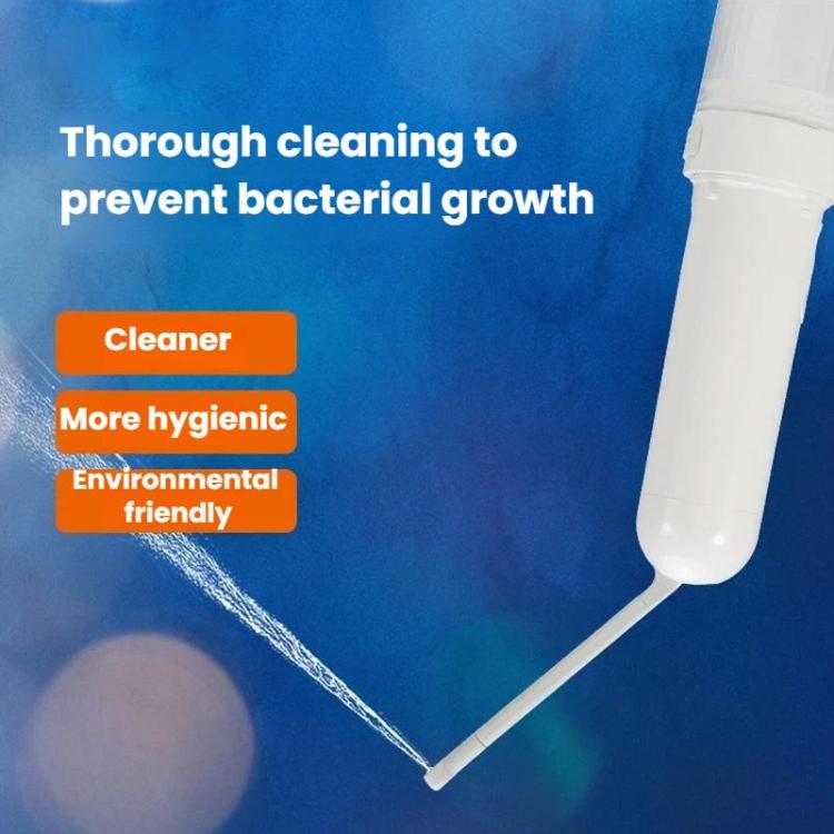 Bidet sprayer nozzle releasing a water stream with flexible hose, white