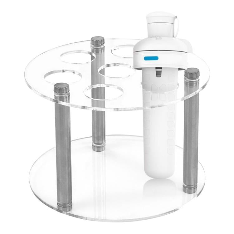 Clear acrylic spice jar holder with seven openings and multiple white bottles on posts