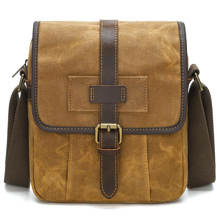 Dusty yellow waxed canvas crossbody bag with leather flap and front buckle