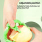 Green hand-crank apple peeler adjusting position on a red apple half