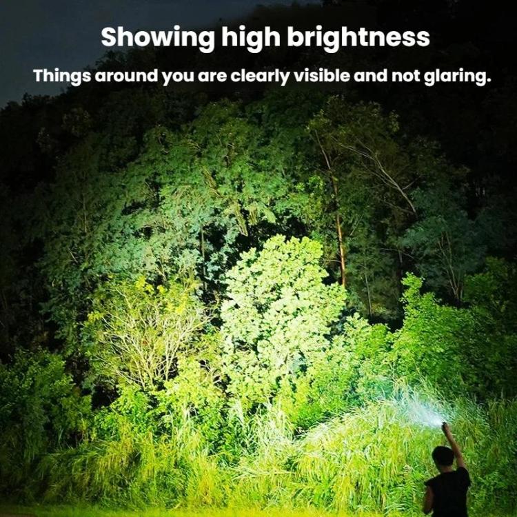Portable LED mini flashlight projecting bright beam onto nearby greenery at night