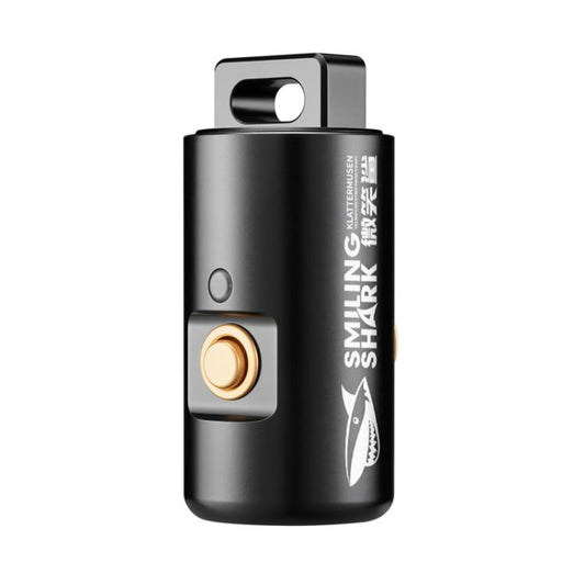 Smiling Shark mini keychain flashlight, black body with brass switch button and lens