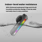 Black bike taillight with multi-color light bar against water splash